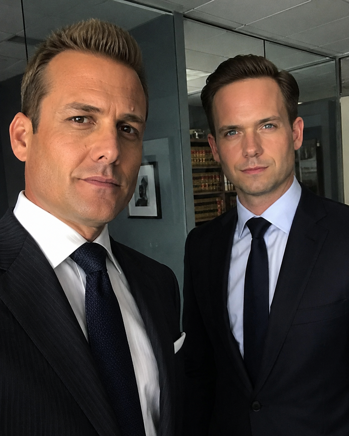A small sticker-style photo of two suited lawyers
